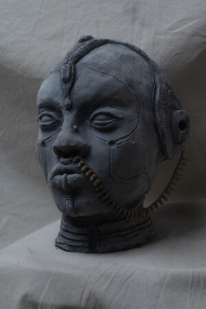 clay sculpture of feminine face