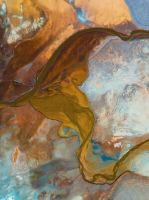 A colorful overhead image of swirling sediment